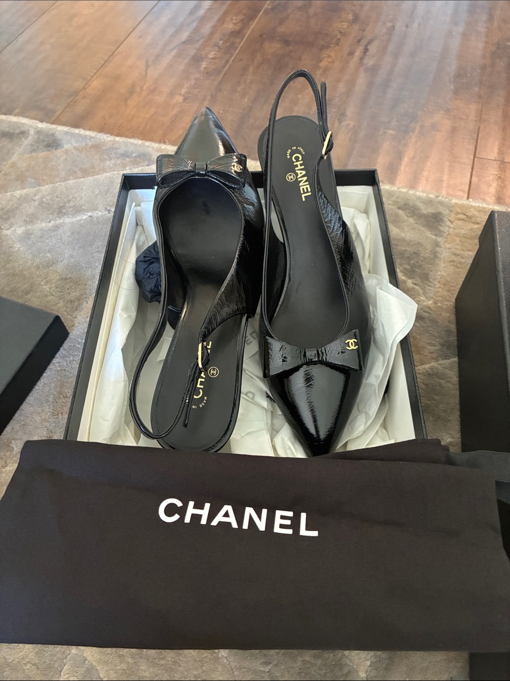 CHANEL Black Patent Leather Pointed Slingback Pumps with Bow Accent